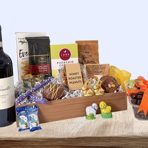 A perfectly sized Easter basket with sweet treats, salty gourmet delights, and a bottle of wine of your choosing.