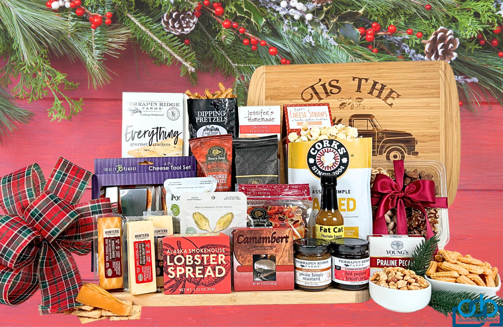 A variety of cheeses and meats with all the accompaniments delivered on a large bamboo cutting board with a touch of holiday magic.