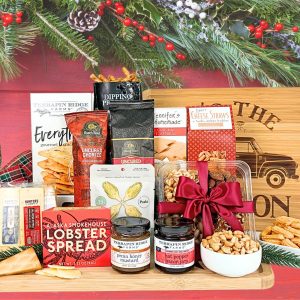 A variety of cheese and meat with all the accompaniments delivered on a large bamboo cutting board with a touch of holiday magic.