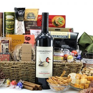 Generous gourmet gift basket filled with assorted chocolates, cheeses, salty snacks, bottle of wine, and more!