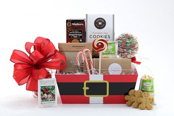 A holiday collection of sweet treats, all delivered in a Santa print gift basket.