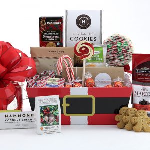 A sweet collection of holiday treats packaged in a Santa print gift basket.