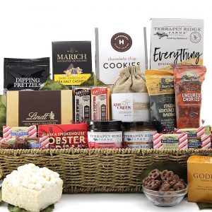 A holiday gift basket delivered with a wide variety of gourmet items and a bottle of wine