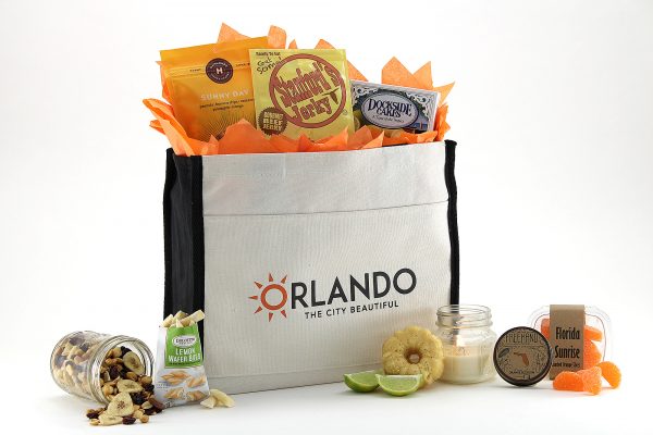 A collection of Florida treats packaged inside an Orlando canvas tote bag.