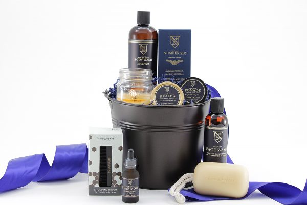 Men's gift bakset containing grooming essentials for beard care. Featuring products from Caswell-Massey, America's Original Soap and Fragrance Company, famous for soaps, skincare, and men's grooming essentials.