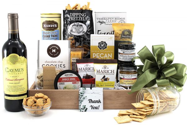 A gift basket to say "thank you" filled with gourmet treats and a bottle of wine