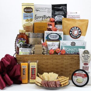 A gift basket of thoughtful treats with a bottle of wine.