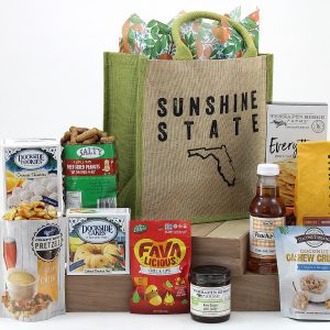 Tote bag with "Sunshine State" printed on the front and filled with assorted Florida-made treats!