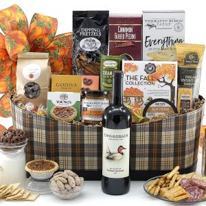 A grand harvest gift basket with flavors and feels of fall plus a bottle of wine!