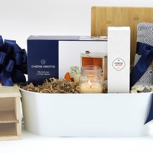 A lovely home-coming gift basket filled with keepsake items. No food in this gift basket.