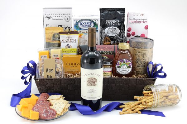 A gift basket full of variety! Sweet, salty, and savory snacks topped off with a fantastic bottle of wine of your choice!