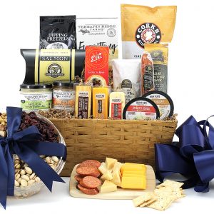 A gift basket full of assorted meats, cheeses, spreads, and salty snacks too!