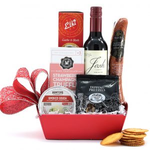 A mini gift basket with a wonderful variety of gourmet treats and a demi bottle of wine.