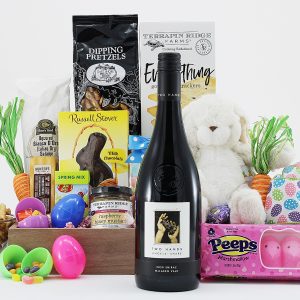A gourmet gift basket filled with Easter treats, a bottle of wine, and a plush bunny!