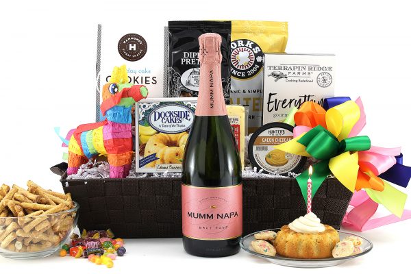 Time to celebrate!  This bright and cheery birthday gift basket is sure to make them smile!  Filled with treats to brighten their birthday, including a candy filled piñata and a bottle of wine!