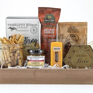 A collection of cheeses, meat, and crunchy snacks delivered in a gift basket. Perfect for any occasion!