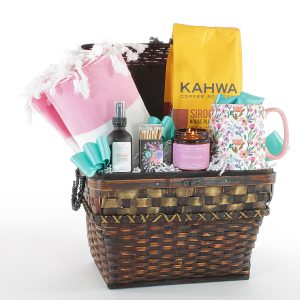 A lovely gift basket filled with gourmet coffee, a spring time scented candle, and so much more!